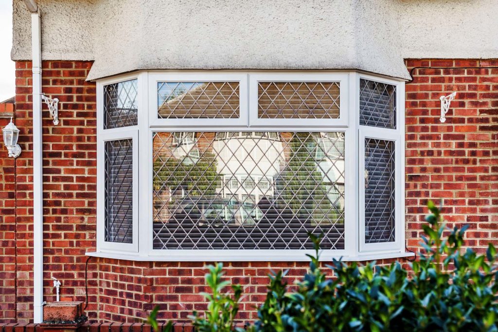 White bow and bay windows installed in a Surrey home.