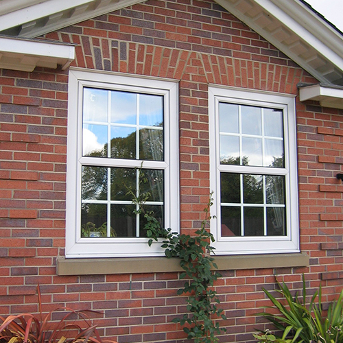 White tilt and turn windows for a home in Surrey.
